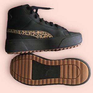 Black and gold Puma shoes